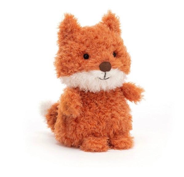 A small plush fox toy with curly orange-brown fur, a white chest and tail tip, and a brown stitched nose, photographed on a clean white background.