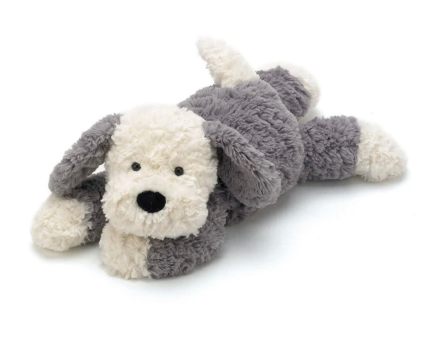 A plush dog toy lying on its side, made of soft fluffy fabric in white and gray with a black nose and eyes, photographed on a clean white background.