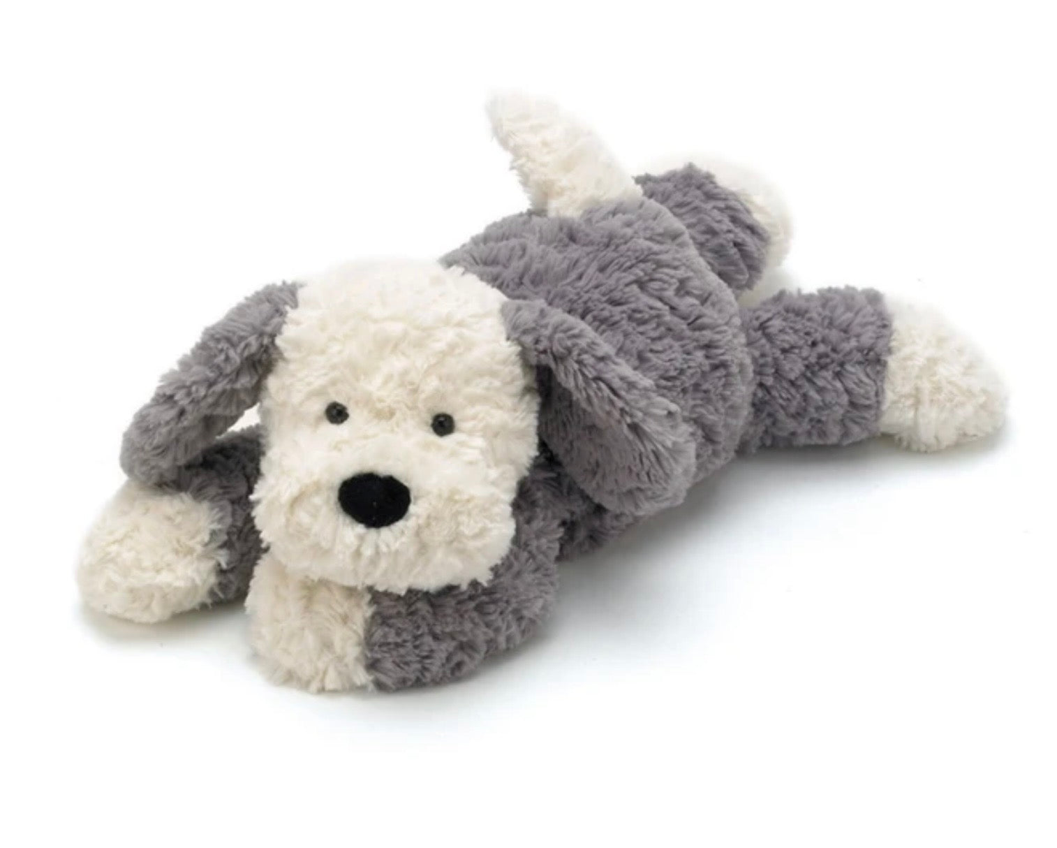 A plush dog toy lying on its side, made of soft fluffy fabric in white and gray with a black nose and eyes, photographed on a clean white background.