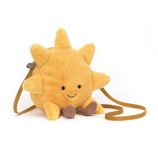 A plush sun-shaped bag with yellow rays, brown cord boots, and a beige strap.