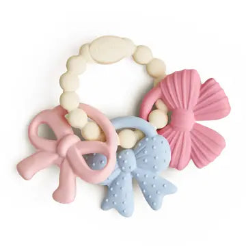 Set of three colorful Itzy Ritzy Itzy Trio Teether - Bows baby teething rings on a white background