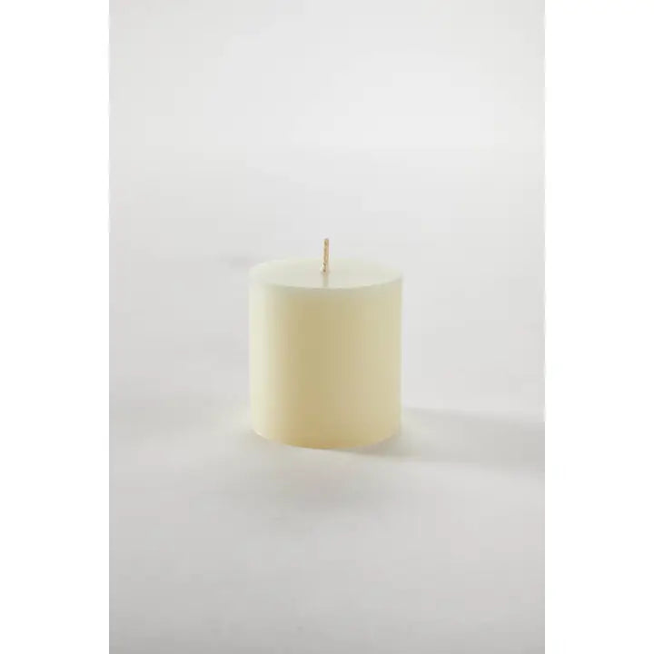 White candle on a white background
