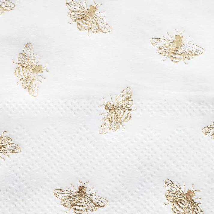 White paper guest towel napkin with gold bee pattern