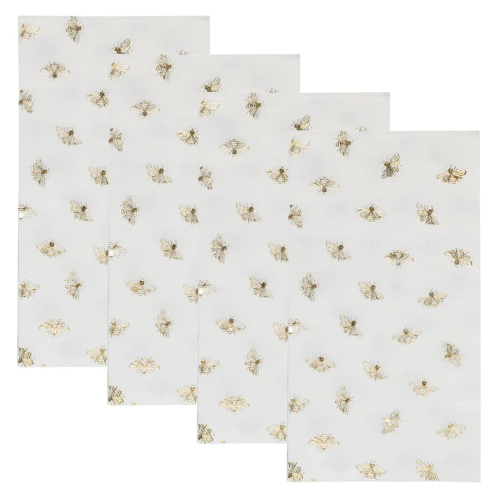 paper guest towel napkins with gold bees on a white background