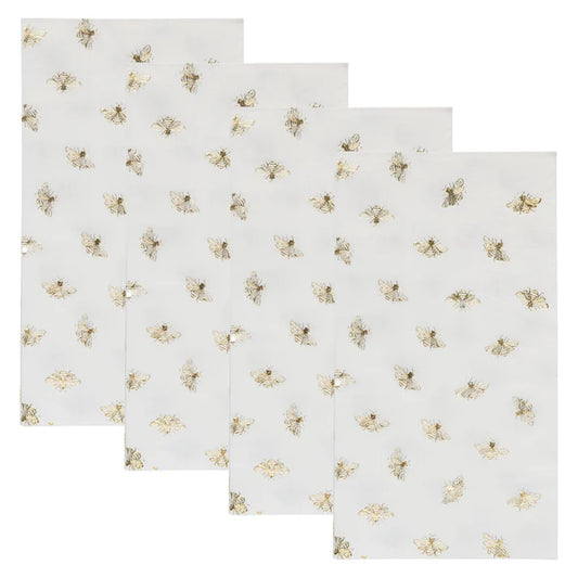 paper guest towel napkins with gold bees on a white background