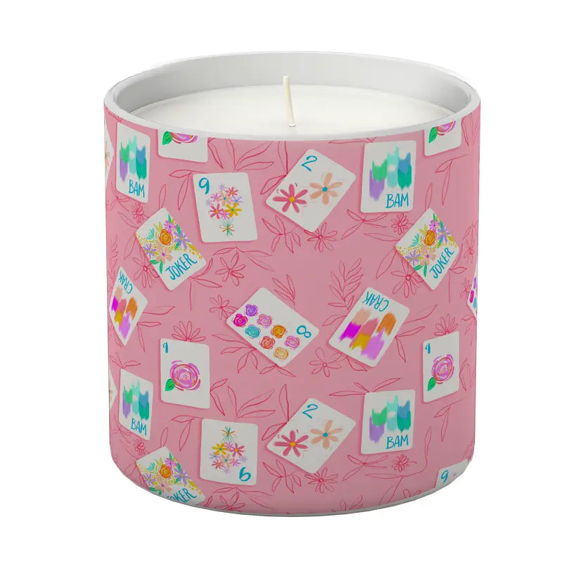Bonjour Mahjong Candle - White Tea & Mint Candle in a pink container with colorful designs on a white background