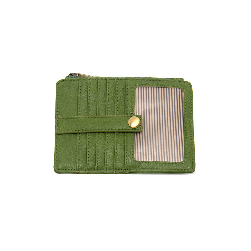 A green vegan leather mini travel wallet with a top zip closure, multiple card pockets, an ID window pocket, and an exterior passport pocket. It has brass plated hardware and a striped lining.