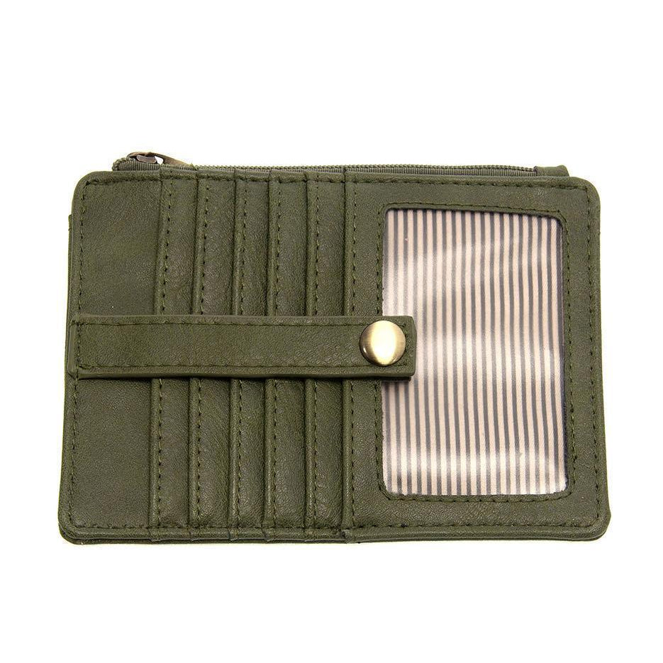A dark basil vegan leather mini travel wallet with a top zip closure, multiple card pockets, an ID window pocket, and an exterior passport pocket. It has brass plated hardware and is slim enough for travel use.
