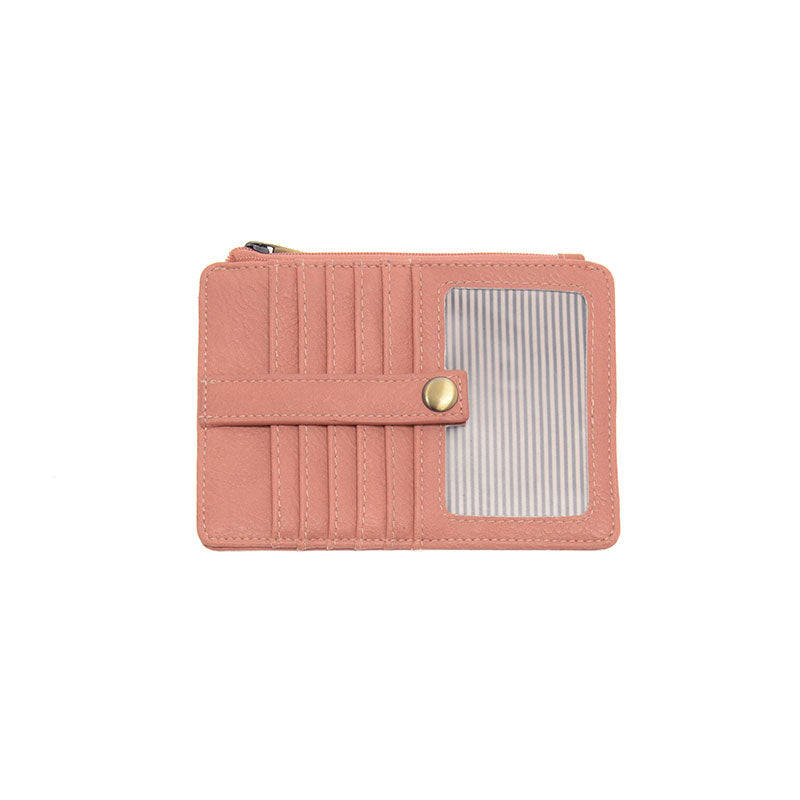 A clay pink mini travel wallet made of vegan leather, featuring a top zip closure and multiple card pockets.