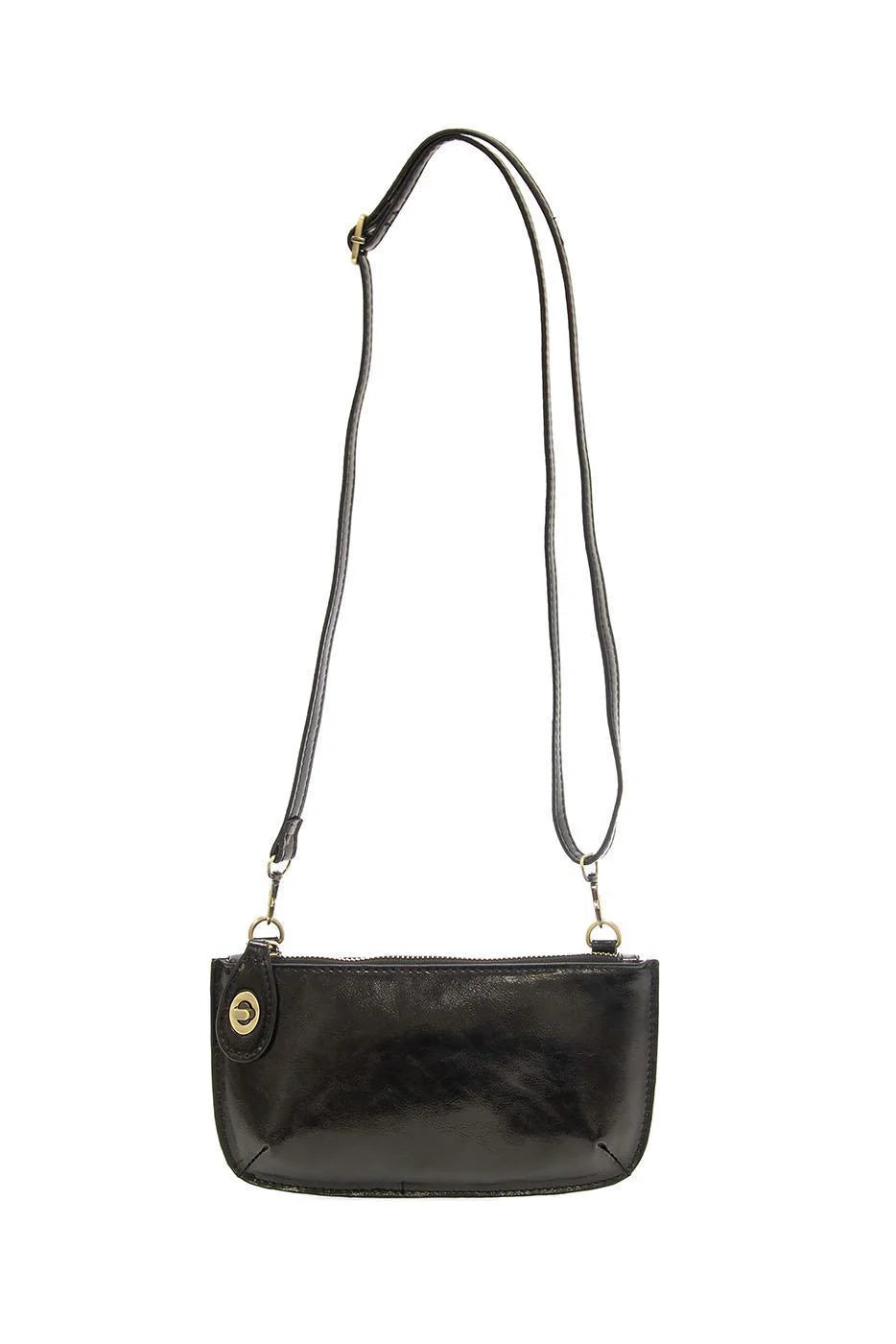 A metallic black mini crossbody wristlet clutch with brass plated hardware and a removable crossbody strap