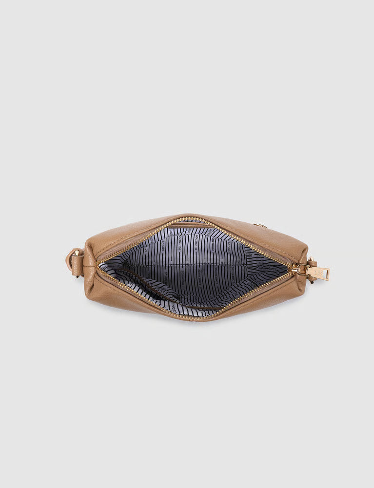 A tan leather zippered pouch shown open from a top-down view, revealing a dark striped interior lining and gold-tone zipper hardware, set against a solid light gray background.