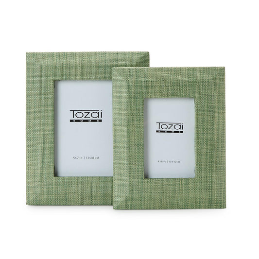 Two green fabric picture frames with 'Tozai' branding