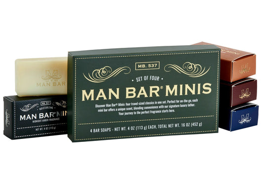 Set of four Man Bar Minis bar soaps with packaging on a white background