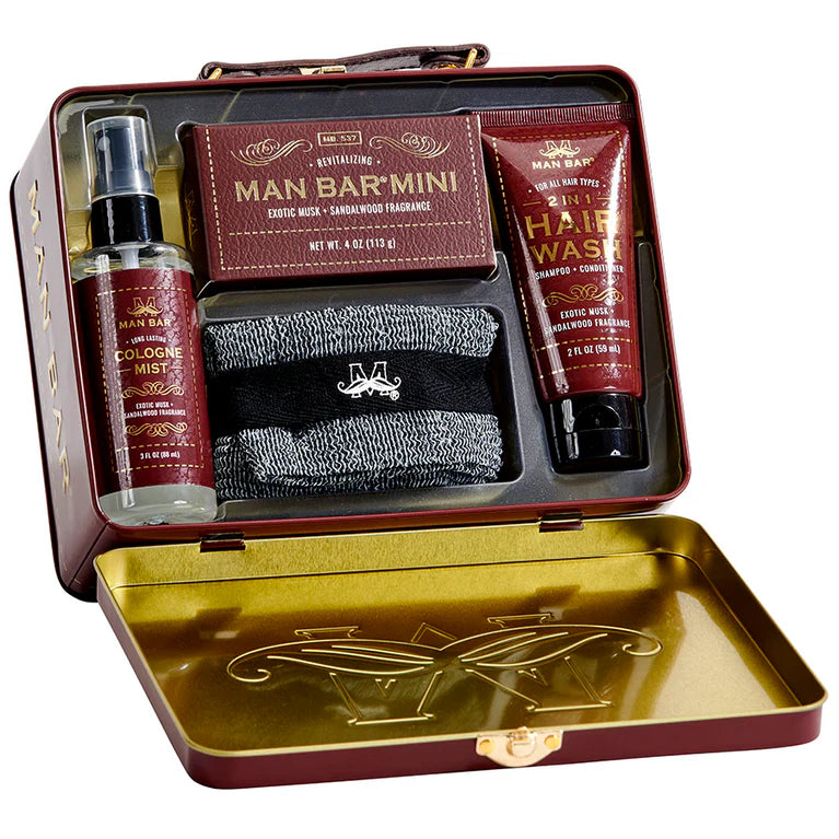 Man Bar mini grooming kit with cologne, hair wash, soap and towel in a decorative box.