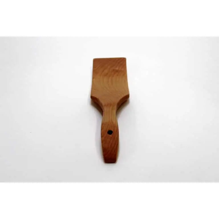 A small wooden spatula or scraper with a rectangular blade and a tapered handle featuring a hole near the end, shown on a plain white background.