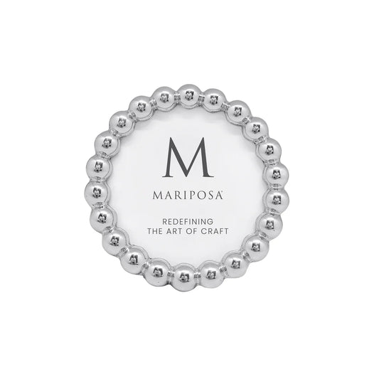 A round silver 3379 Baubles 4x4 picture frame with a beaded outer border and a white center, featuring the brand name 'MARIPOSA' and a large 'M' logo.