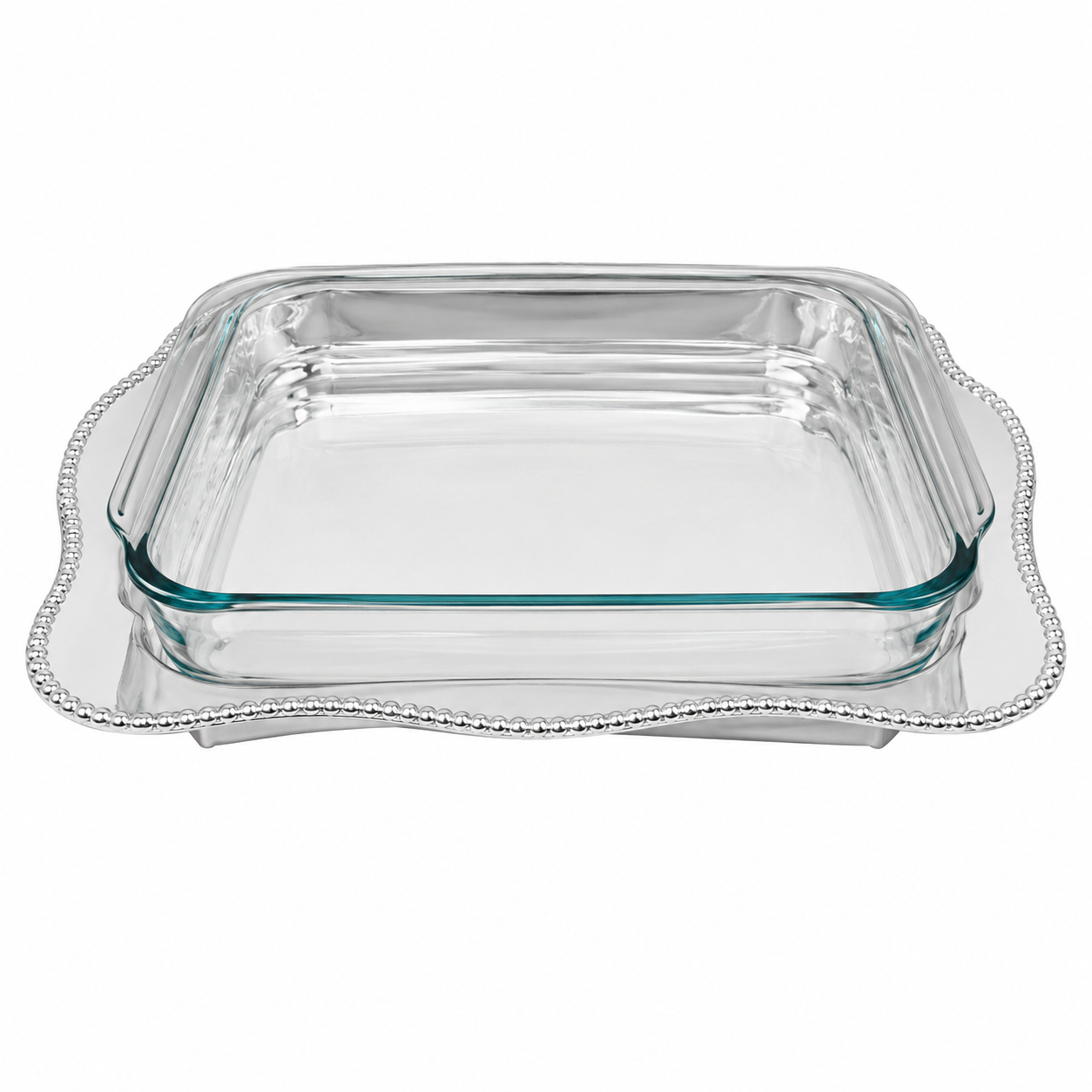A clear glass baking dish with a silver Mariposa 3613 Sueno oblong casserole caddy with  scalloped beaded tray underneath, shown on a plain white background.