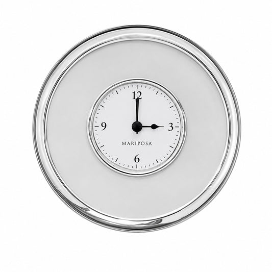 A round clock with a polished silver-tone frame and a white dial. The dial features black Arabic numerals, black hands, and the brand name 'MARIPOSA' printed below the 12 o'clock mark.