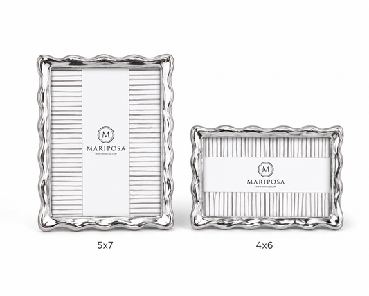 Two silver picture frames with wavy scalloped edges, shown on a white background. The larger frame is labeled 5x7 and the smaller frame is labeled 4x6.