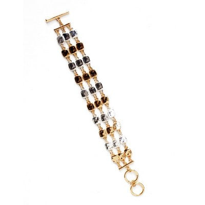 Meghan Browne KYRO-GS gold toggle close bracelet with three gold chain strands of beads of gold, black, brown, gray and clear beads