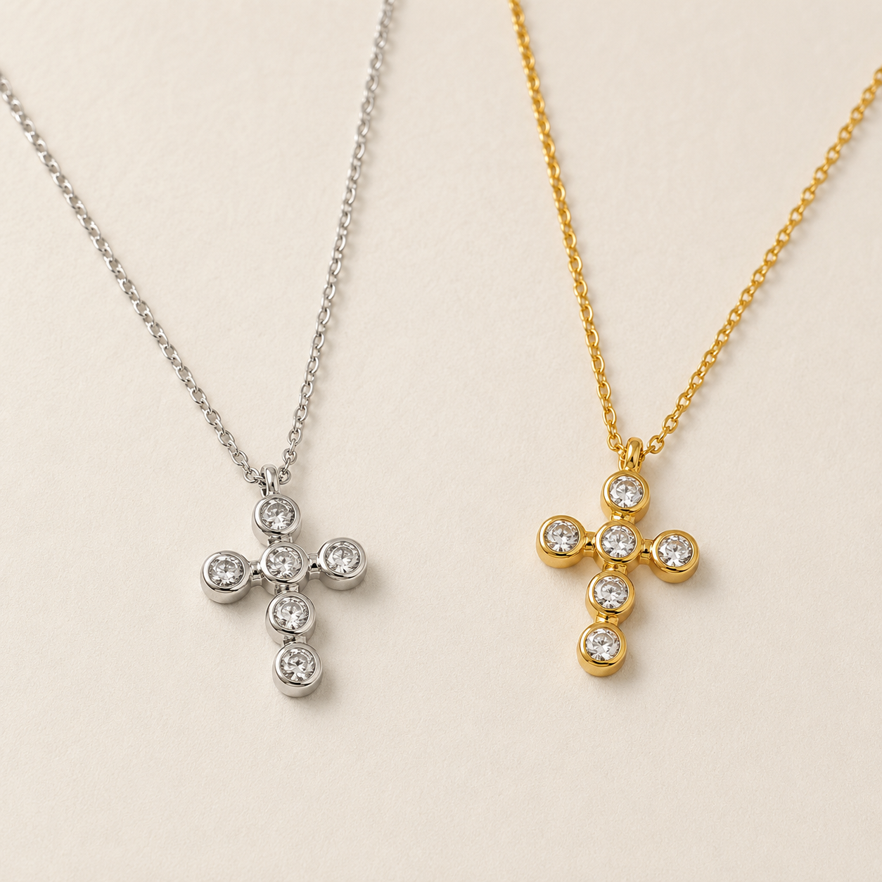 Meghan Browne ABI-SV and ABI-GD  necklaces both have a cross pendant with clear diamond like crystals in the shape of a cross one in gold and the other silver