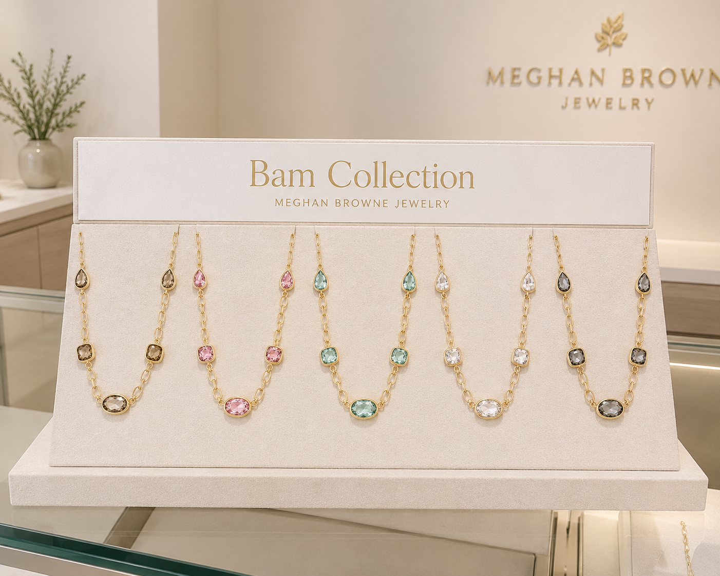 Meghan Browne Bam necklace collection in pink, mint, clear, black diamond and topaz