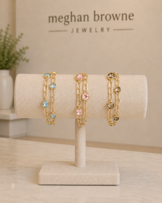 Meghan Browne Goldie bracelets each with a double gold chain link with colored gemstones 