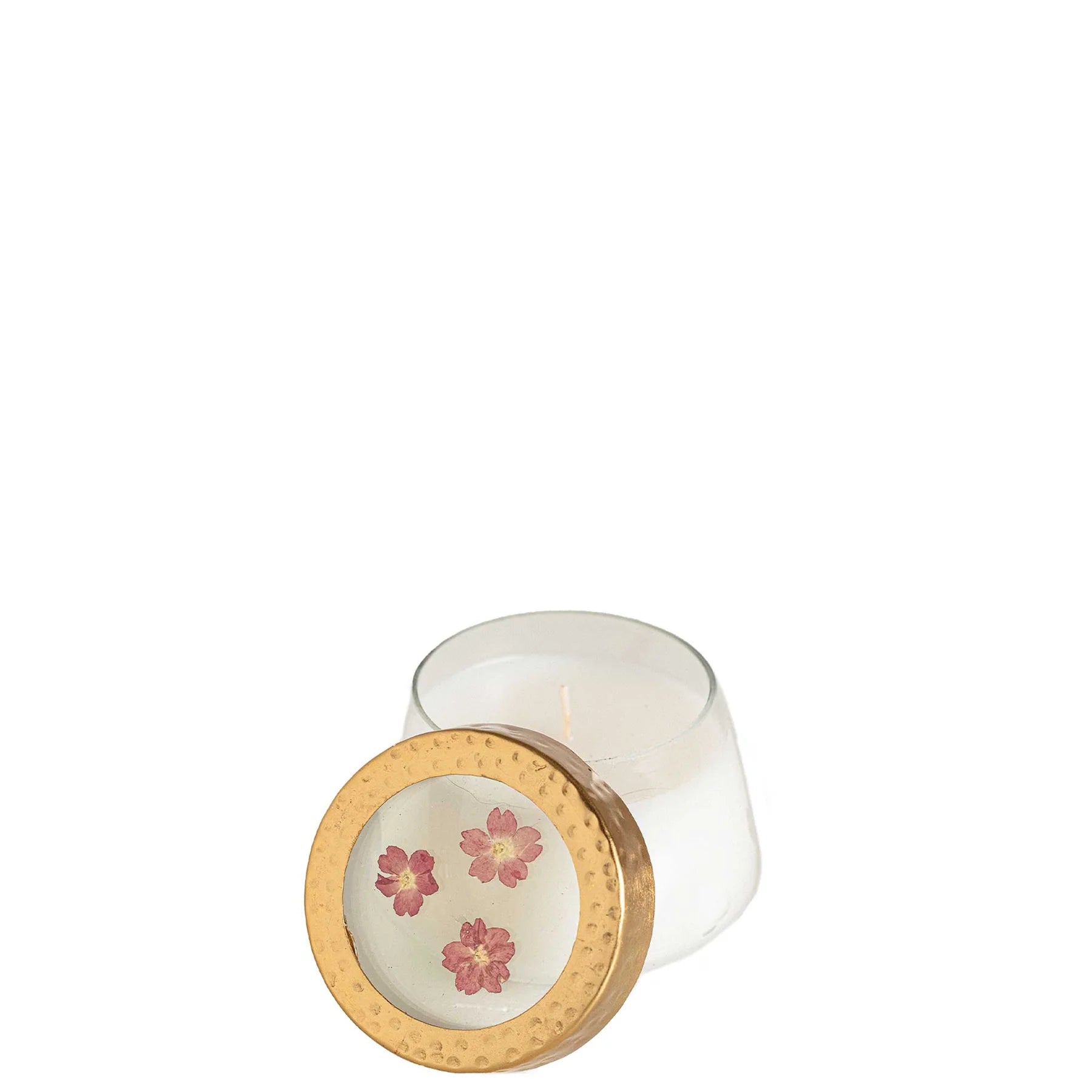 Jar candle with floral design in the middle of the clear lid with a gold rim