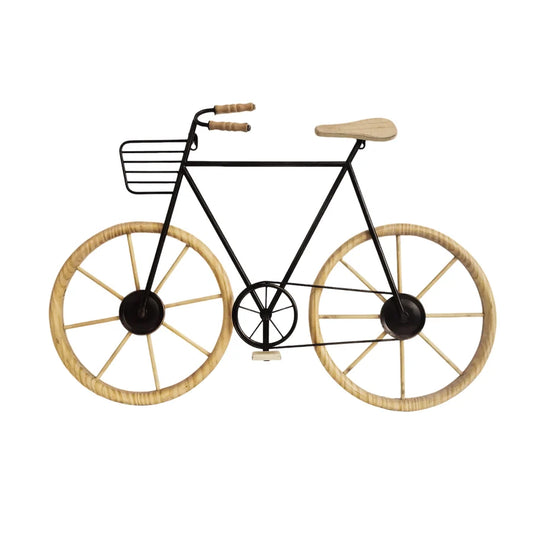 A decorative wall-mounted bicycle sculpture with a black metal frame, light natural wood seat and handlebar grips, and large spoked wheels with black centers and light wood rims.