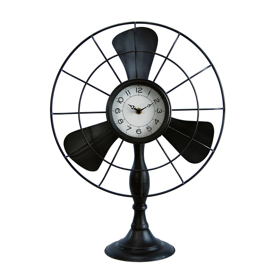 Decorative table clock designed like a vintage fan on a white background