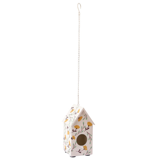 White metal birdhouse with a yellow floral design with green leaf stems, hanging on a chain.