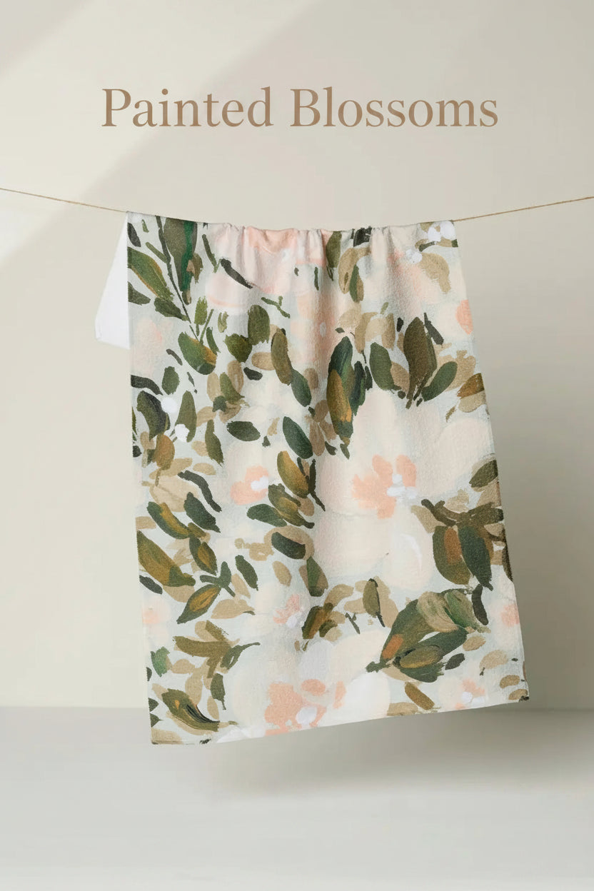 Floral patterned Geometry painted blossoms tea towel hanging on a line against a neutral background