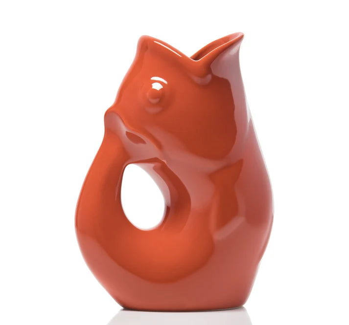 GurglePot Mini pitcher in the shape of a fish in a paprika color