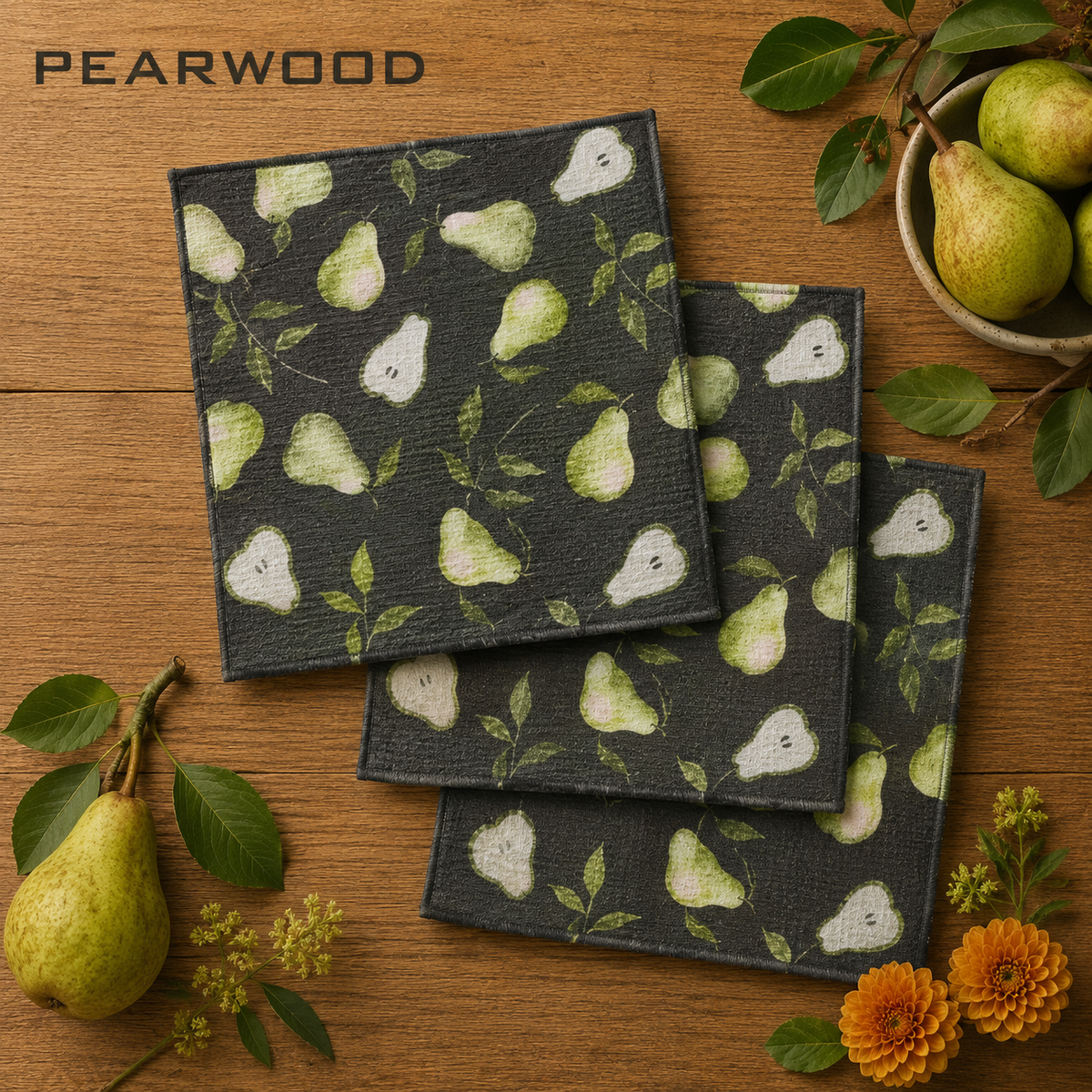 Geometry Dishcloth set of three square black fabric woven dishcloths with a light green pear and leaf pattern.  Accented with pairs and flowers with the word Pearwood indicating the print.  The Little Exchange SKU 150061