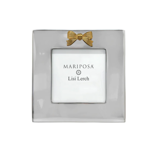 A square silver picture frame with a small gold bow detail at the top and a white insert card displaying the brands 'MARIPOSA' and 'Lisi Lerch'.