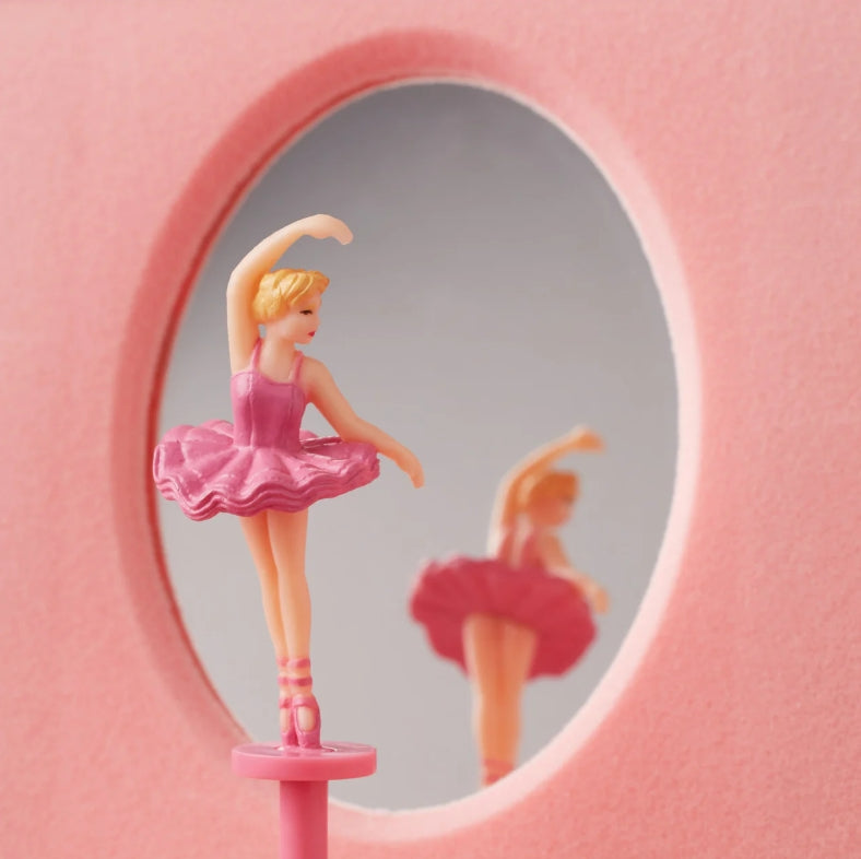 Ballerina figurine in a pink dress standing in front of a mirror on a pink background in a Lenox Jewelry box available at the Little Exchange