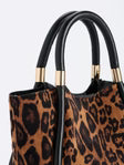 Leopard print Shiraleah Danny Mini Tote handbag with black handles on a light gray background