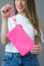 Stia Everyday Essentials Nylon Wristlet woman holding pink wristlet