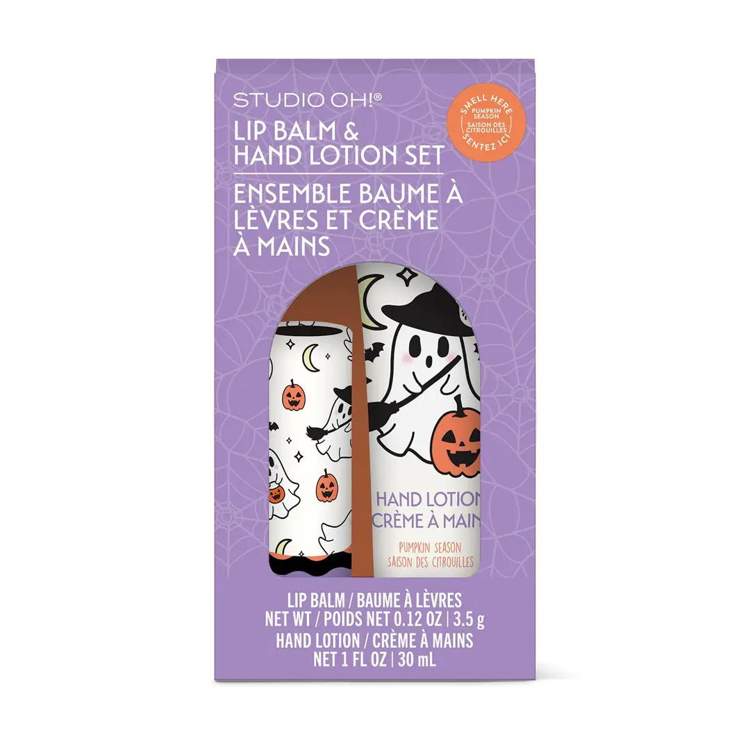 Studio Oh! Halloween-themed lip balm and hand lotion set in a purple box with white text and illustrations of a witch, ghost, spiderwebs, and pumpkins.