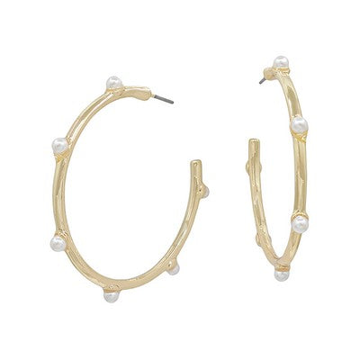 Meghan Browne TRAV-GP Gold hoop earrings with pearl beads on a white background