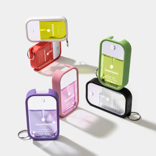Multiple images of Touchland hand mist cases in different colors
