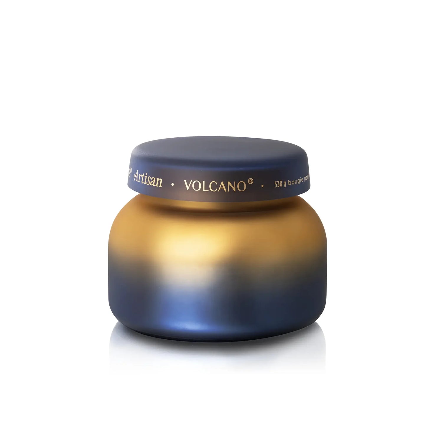 Gradient blue to gold candle with 'Artisan Volcano' branding on a white background