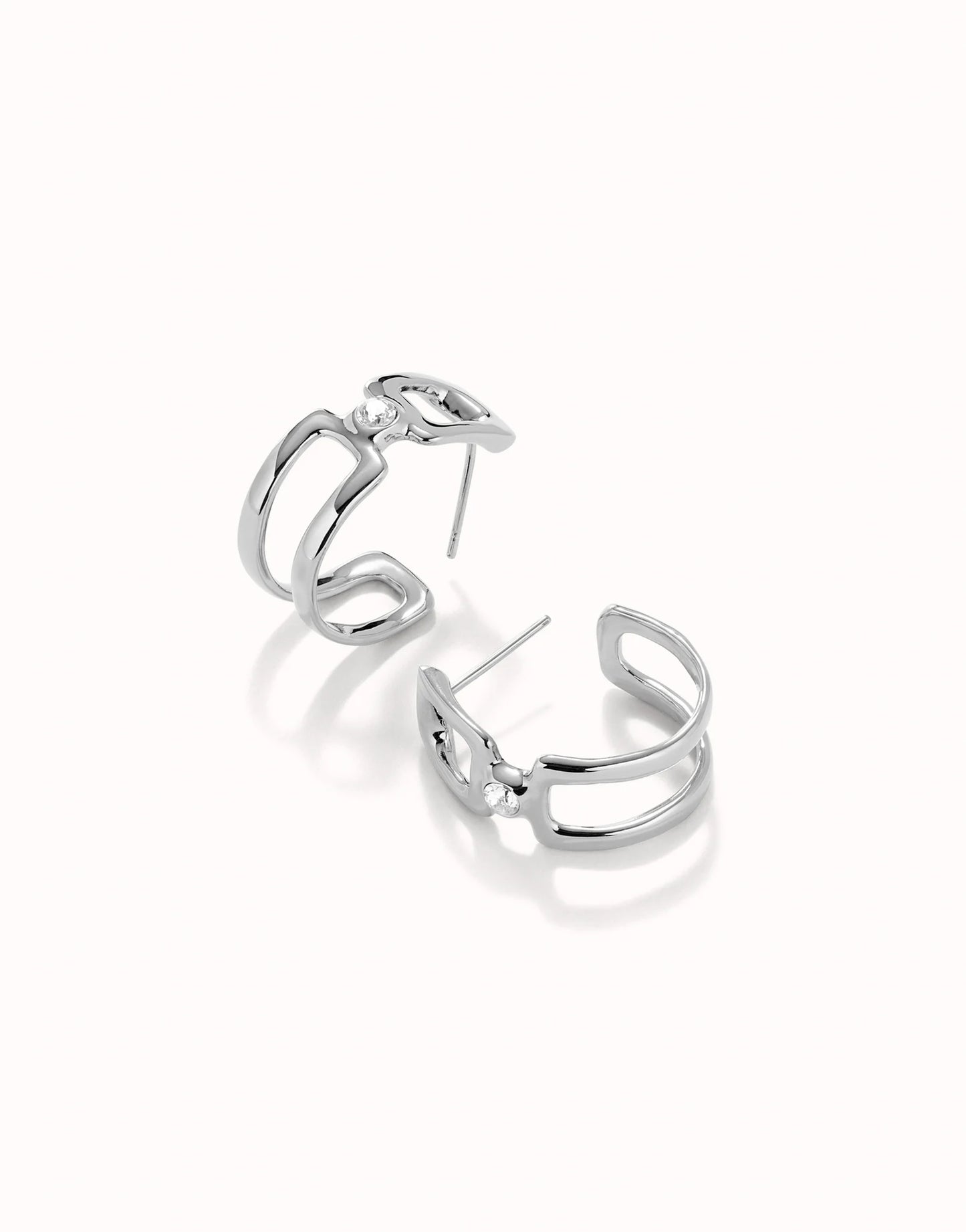 UNOde50 Ser Indomitable Silver Hoop Earrings with White Topaz on white background