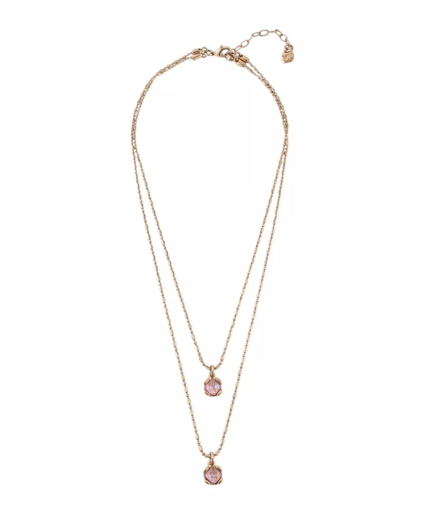 Two-layered necklace by UNOde50 with pink stones on a white background
