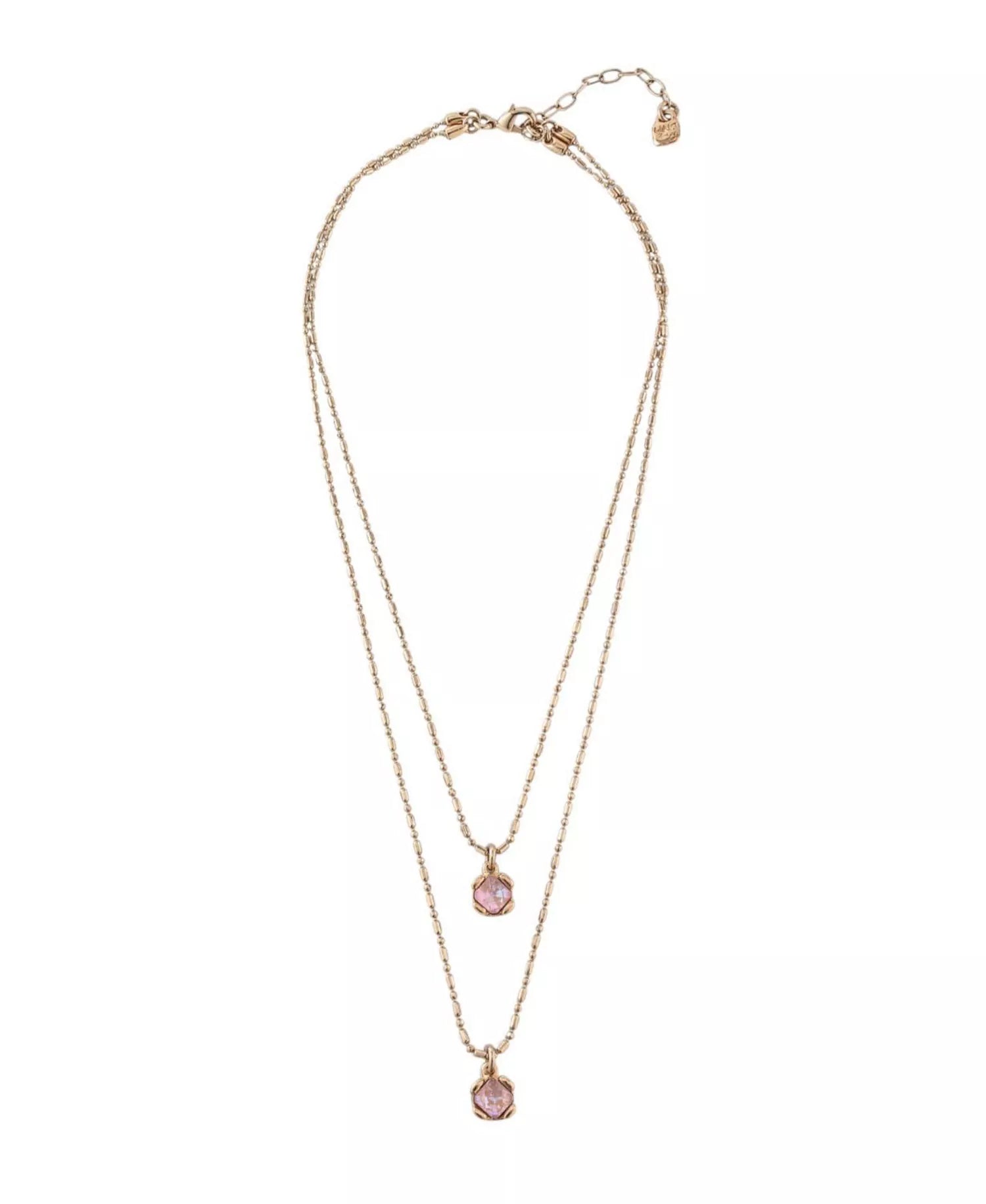 Two-layered necklace by UNOde50 with pink stones on a white background