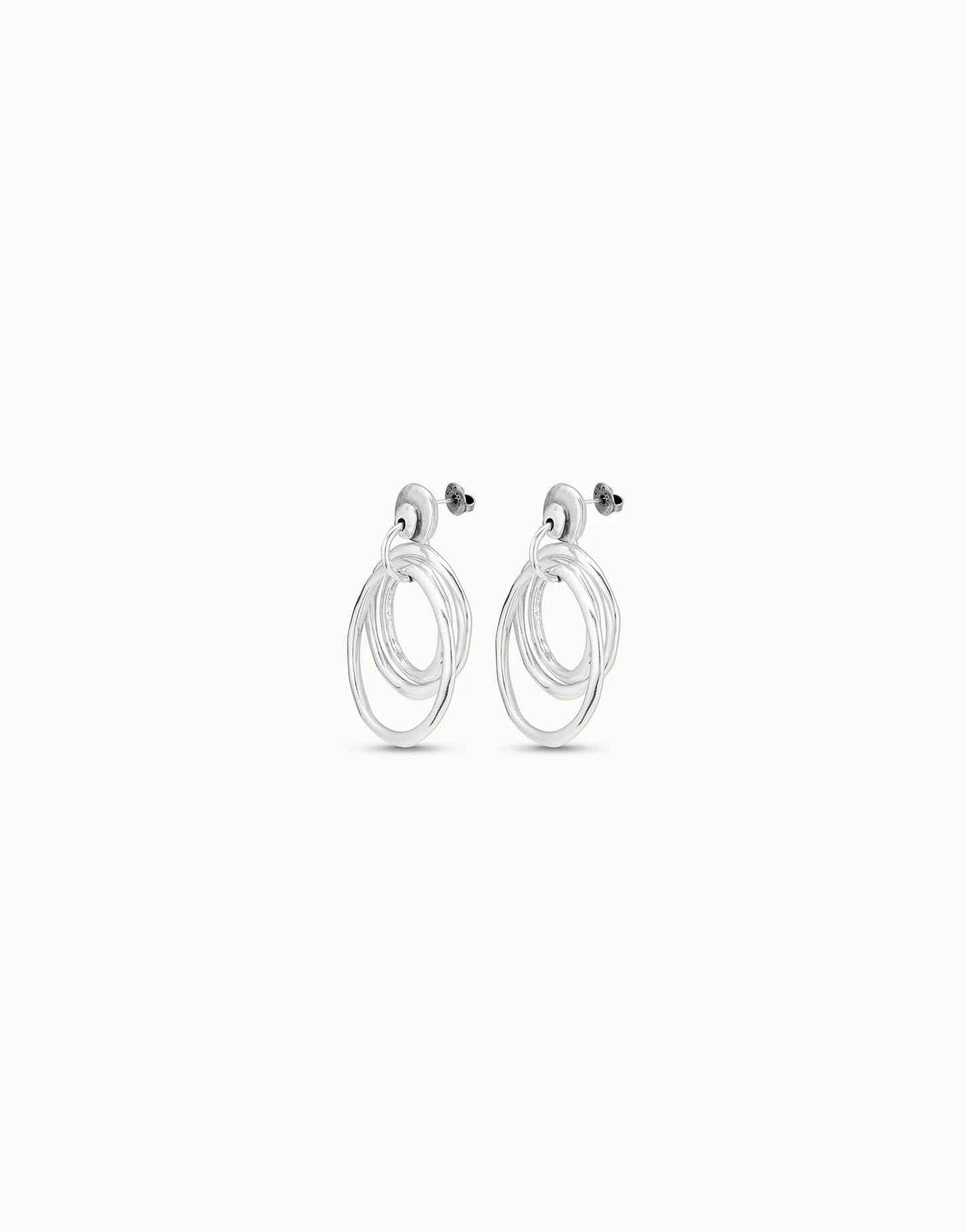 Side view with back clasps of UNOde50 En La Onda Silver Irregular Hoop Earrings