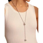 Woman wearing a white sleeveless top with an UNOde50 Lonely Planet Silver Drop Necklace with Two Silver Beads