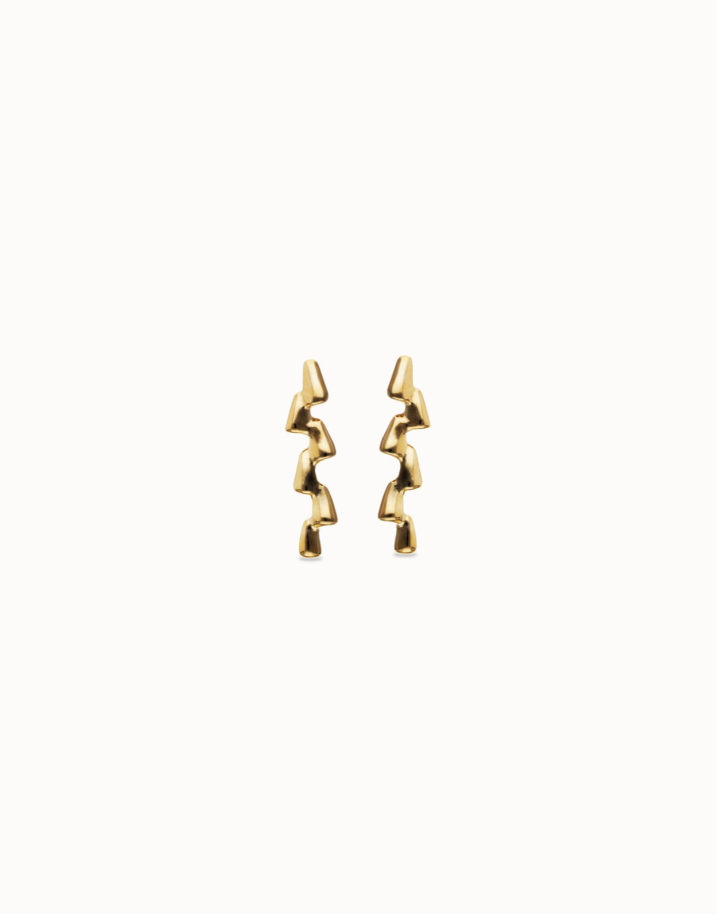 UNOde50 gold zigzag drop earrings on a white background