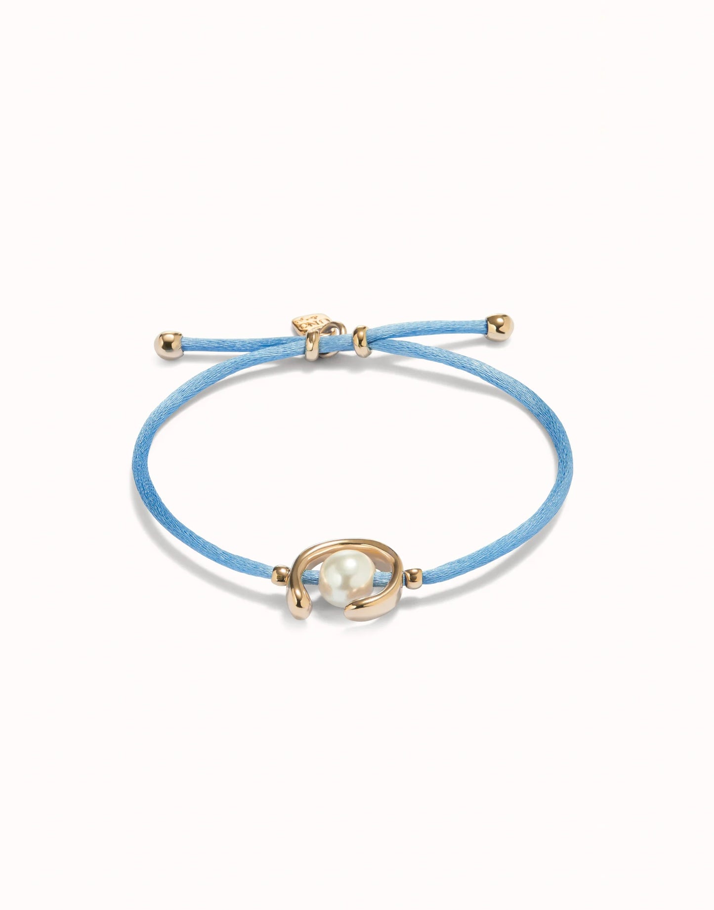 unode50 Blue bracelet with gold clasp and pearl-like bead on a white background