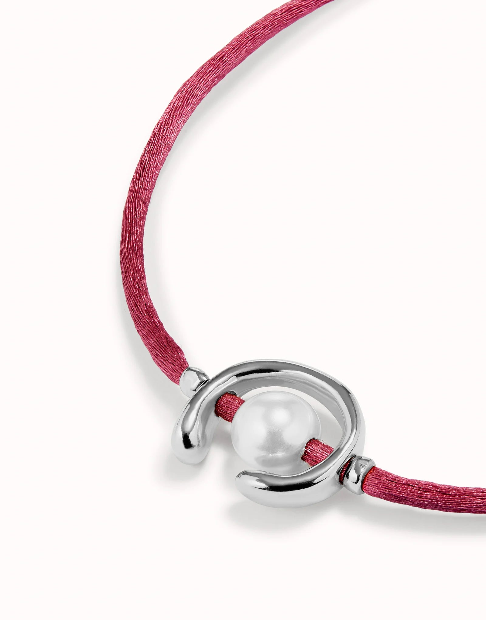 Bracelet with a silver clasp and pink cord on a white background